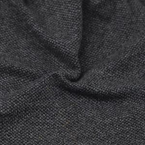 Close-up of charcoal gray breathable knit fabric showing soft texture and fine grain