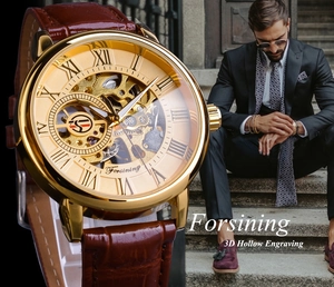 Close-up of golden hollow mechanical watch with brown leather strap on business model