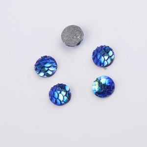 Detailed view of 8mm blue fish scale resin beads showing front texture and metal backing