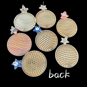 Back view of star-shaped disco ball earrings with acrylic glitter and grid texture