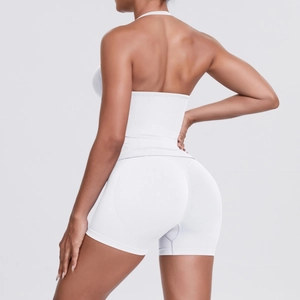 Close-up of seamless white yoga set featuring textured fabric and contoured back design