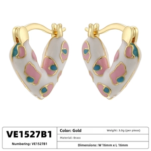 Detail view of gold brass heart earrings with colorful enamel spotted pattern and dimensions