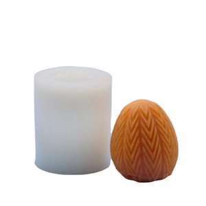 Easter egg silicone mold for DIY candles featuring a textured grid and woven V-pattern