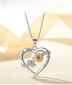 Macro detail of S925 silver heart bee pendant with I love you forever engraving
