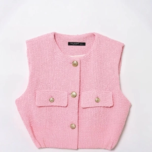 Pink tweed sleeveless vest with vintage gold buttons and decorative flap pockets