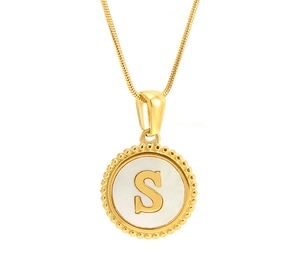 Detail of 18K gold snake chain necklace with shell inlay pendant featuring letter S