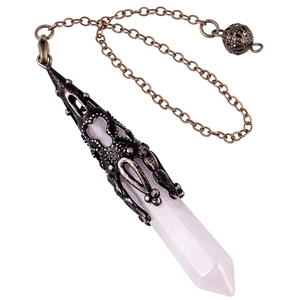 Macro view of natural rose quartz hexagonal prism pendant with vintage engraved bronze cap