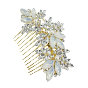 Golden bridal hair comb featuring marquise crystals, pearls and opal stones on a white background