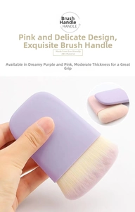 Macro view of wide flat foundation brush with pink ABS handle and dense fiber bristles