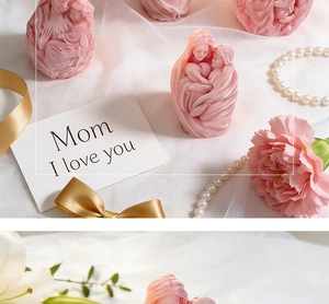 Detail of pink relief scented candle featuring mother and child silhouette with carnations