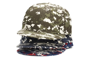Stack of camouflage flat brim baseball caps in green, blue, and red digital prints