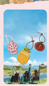 Detail of mushroom, pineapple and tomato leather magnetic hat clips with adjustable straps