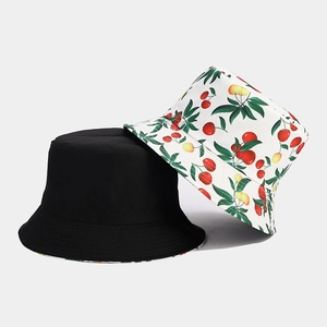 Detailed view of bucket hat stitching with black color and red cherry fruit print pattern