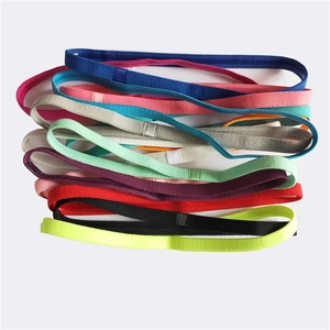 Macro shot of colorful non-slip elastic sports headbands in various vibrant candy colors