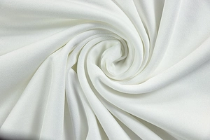 Detailed macro view showing the fine texture and knit structure of white elastic fabric