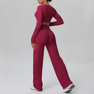 Detail view of wine red long sleeve crop top and high waist wide leg yoga set