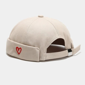 Beige cotton docker hat with red heart embroidery and adjustable metal buckle strap