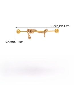Detail of golden stainless steel industrial barbell featuring a snake design with dimensions