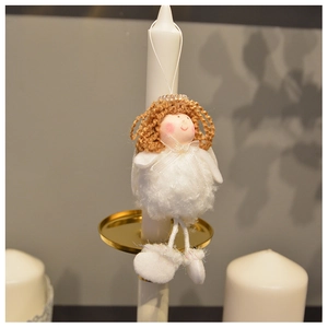 Detailed view of a plush white angel ornament with brown hair and soft wings