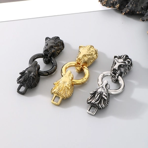 Detail of lion and wolf head metal connectors for jewelry in black, gold, and silver