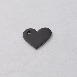 Detailed view of smooth black heart pendant with top hole for jewelry making