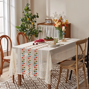 Lace tablecloth with colorful leaf embroidery and delicate floral lace edge detail