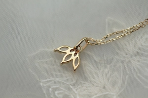 Macro view of gold S925 sterling silver necklace with marquise diamond pendant details