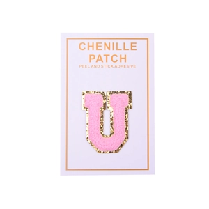 Detail of pink chenille letter U patch with gold sequins and peel-and-stick adhesive back