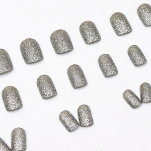 Short silver glitter press-on nails in square round shape on a white background