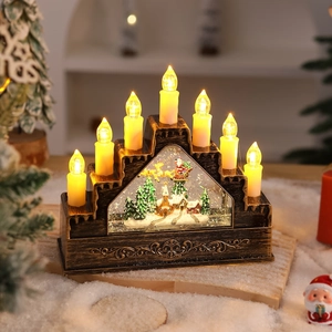 Close-up of 7 warm LED candles and Santa sleigh scene inside a bronze music box lantern