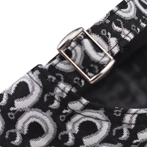 Detailed close-up of a baseball cap's jacquard fabric and silver metal adjustment buckle