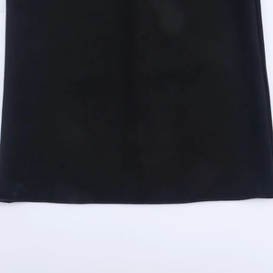 Detailed close-up showing the high-quality black fabric hem and stitching on a midi dress