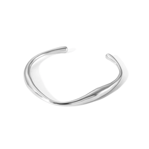 Macro shot of silver irregular fluid sculpture cuff bangle in polished stainless steel