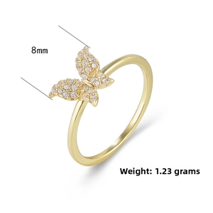 Macro detail of 8mm gold butterfly ring with white zircon stones weighing 1.23g