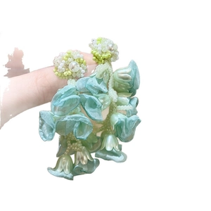 Elegant mint green fabric flower tassel earrings perfect for summer beach vacations