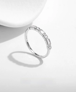 Macro view of S925 sterling silver ring showing rectangular and round zircon inlay details