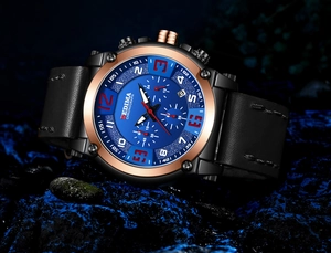 Detail view of Bedima chronograph watch with blue dial and rose gold bezel on stone