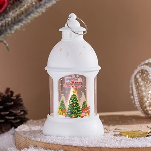 Close-up of a white Christmas lantern with internal candle light and festive tree prints
