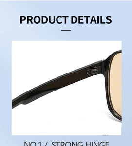 Detail of reinforced metal strong hinge on black frames with yellow lenses