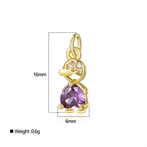 Gold duck pendant with purple heart gem and clear stones, dimensions 16mm by 6mm