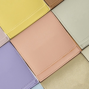 Multi-color PU leather storage pouches with stitched edges and soft textured finish