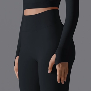 Detail of high waist yoga leggings and long sleeve top with ribbed cuffs and thumb holes