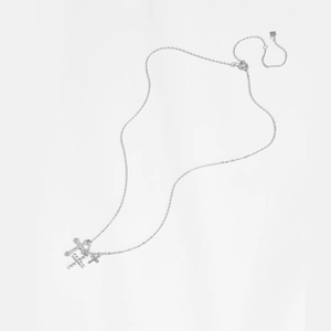Detail view of S925 sterling silver cross necklace with triple layered pendants on white background