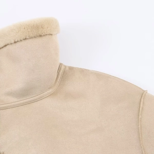 Close-up of the beige suede jacket showing soft faux fur collar and premium stitching detail