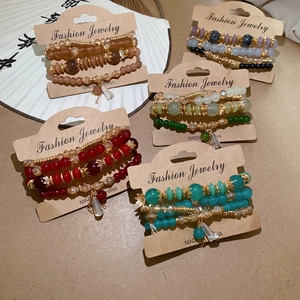 Chic multi-layer beaded bracelet set with crystal charms in various vibrant colors