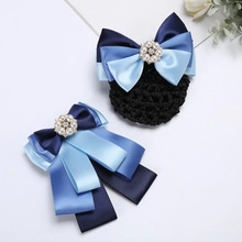 Detail of satin ribbon hair clip and net with pearls and rhinestones in navy and light blue
