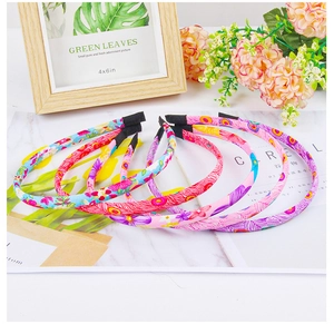 Detail of fabric wrapped headbands with floral and checkered patterns for girls