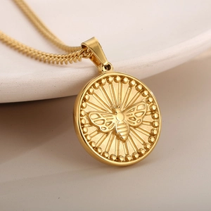 Retro multi-layer gold titanium steel necklace with detailed bee coin pendant design