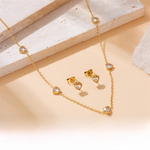 Detail of gold-plated stainless steel necklace and heart-shaped stud earring set