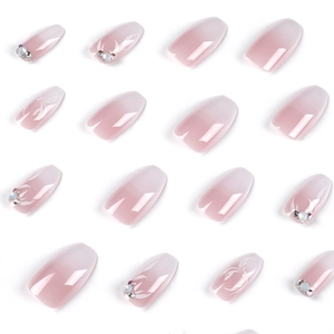 Pink and white gradient short press-on nails with 3D flower petals and crystal rhinestones